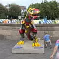 Children swarm over a dinosaur above the market, A July Miscellany, Diss, Eye and Norwich - 23rd July 2022