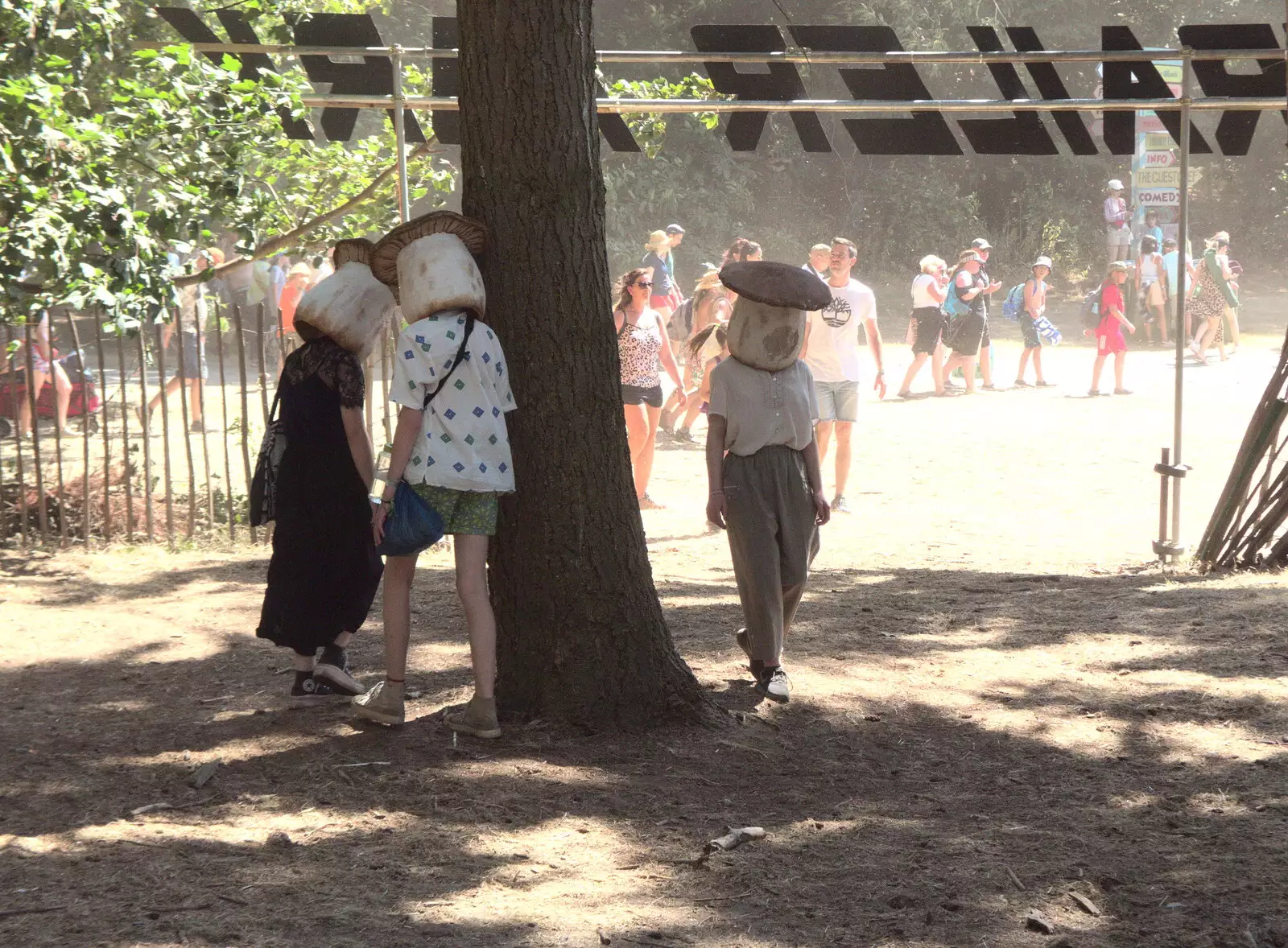 People walk around trees with mushroom heads, from A Day at Latitude, Henham Park, Suffolk - 24th July 2022