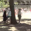 People walk around trees with mushroom heads, A Day at Latitude, Henham Park, Suffolk - 24th July 2022