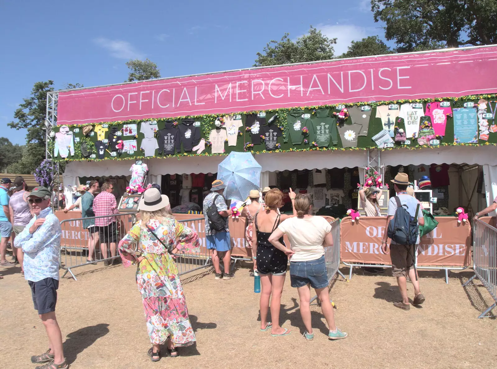 Isobel gets gouged at the merchandise stand, from A Day at Latitude, Henham Park, Suffolk - 24th July 2022