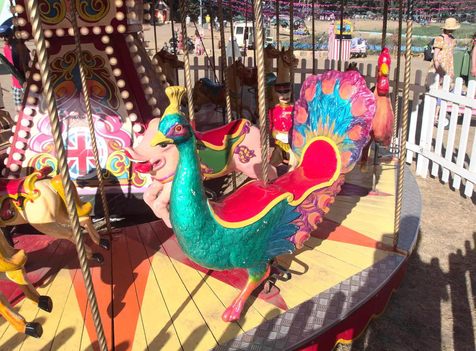 A brightly-coloured bird on the carousel, from A Day at Latitude, Henham Park, Suffolk - 24th July 2022