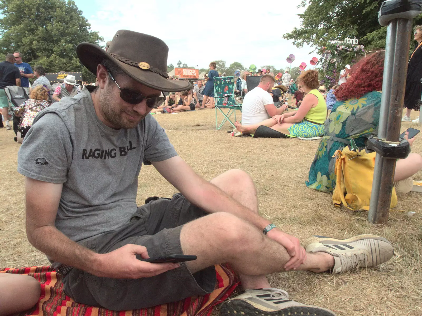 Phil checks his phone, from A Day at Latitude, Henham Park, Suffolk - 24th July 2022