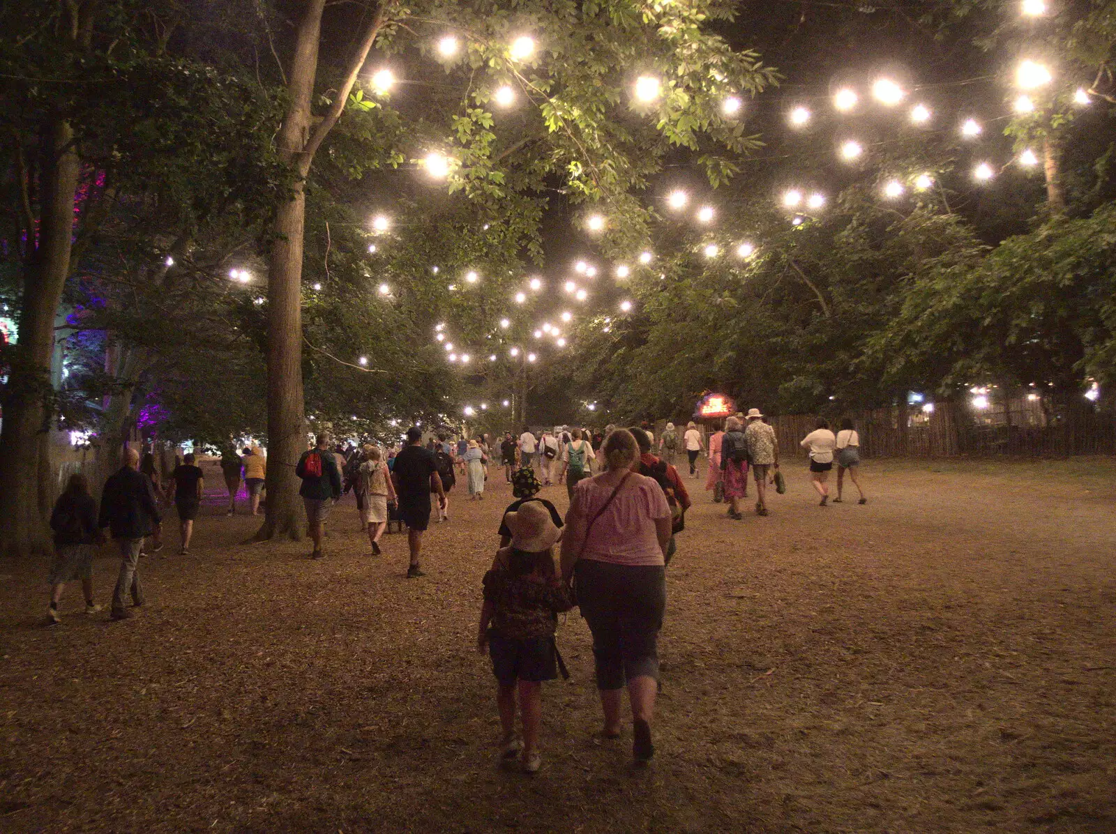 The trees are lit up on the way back to the car park, from A Day at Latitude, Henham Park, Suffolk - 24th July 2022