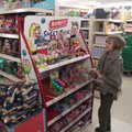 The Eye Piggy Tail Trail and Ipswich Dereliction, Suffolk - 29th July 2022, Harry checks out sweets in the Co-op