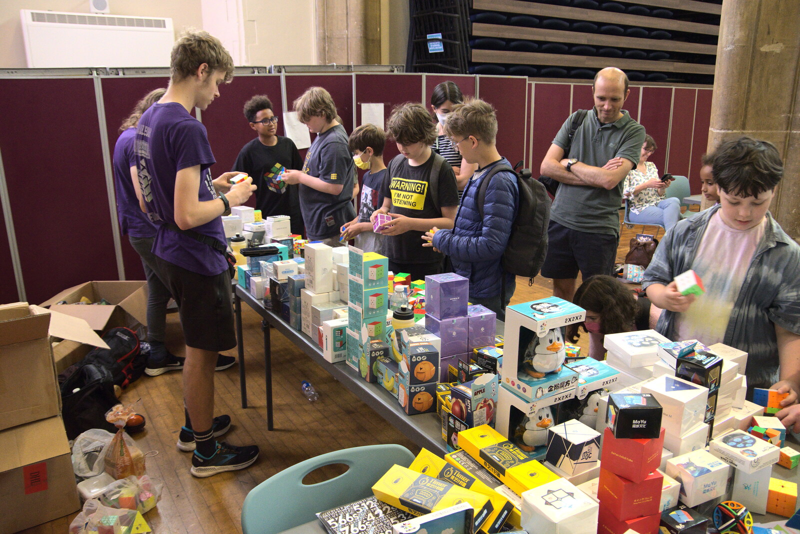 The World Cube Association Rubik's Competition, St. Andrew's Hall, Norwich - 31st July 2022: The boys test out some cube merchandise