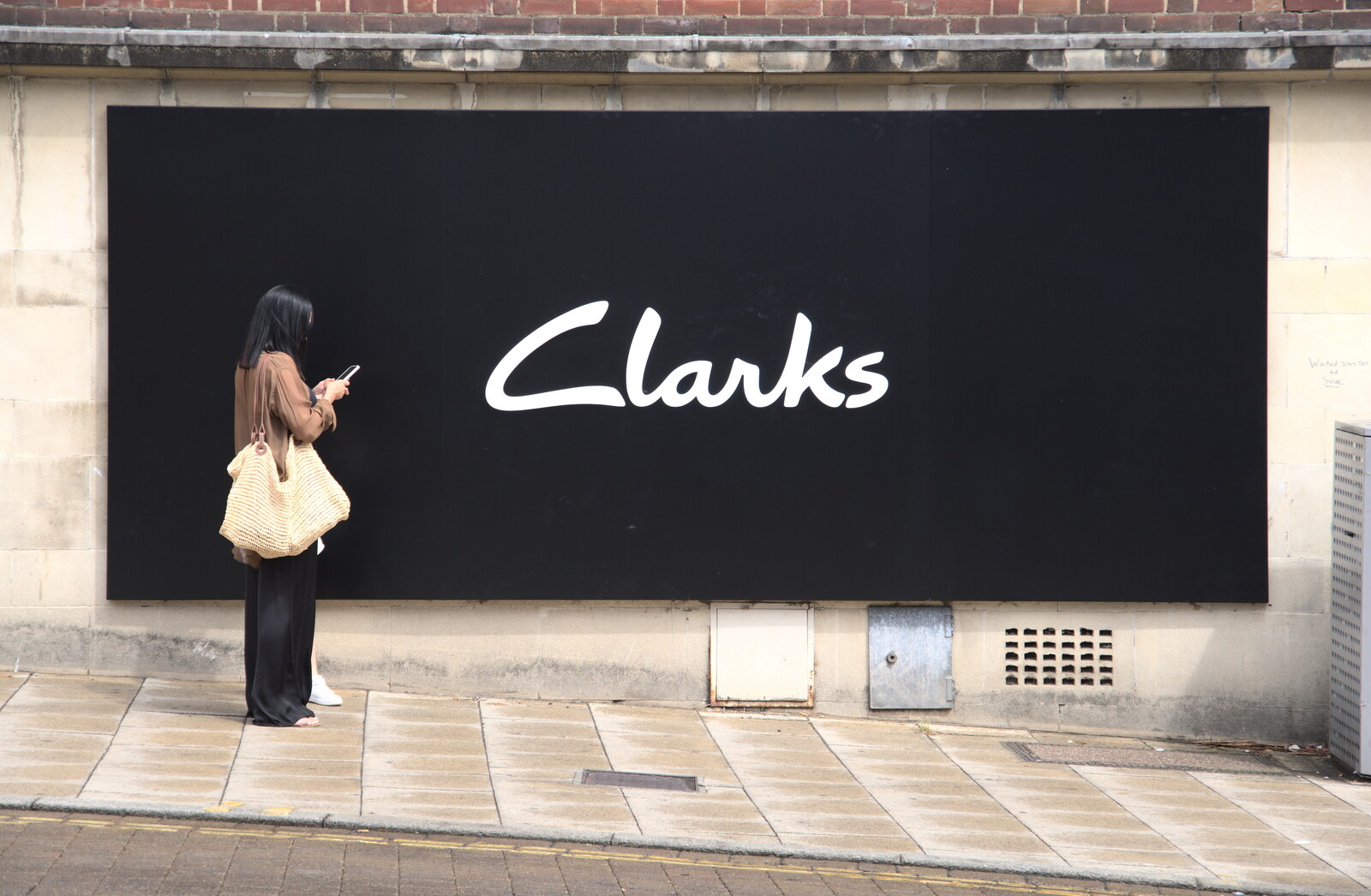 The World Cube Association Rubik's Competition, St. Andrew's Hall, Norwich - 31st July 2022: The big but simple Clarks hoarding is quite striking