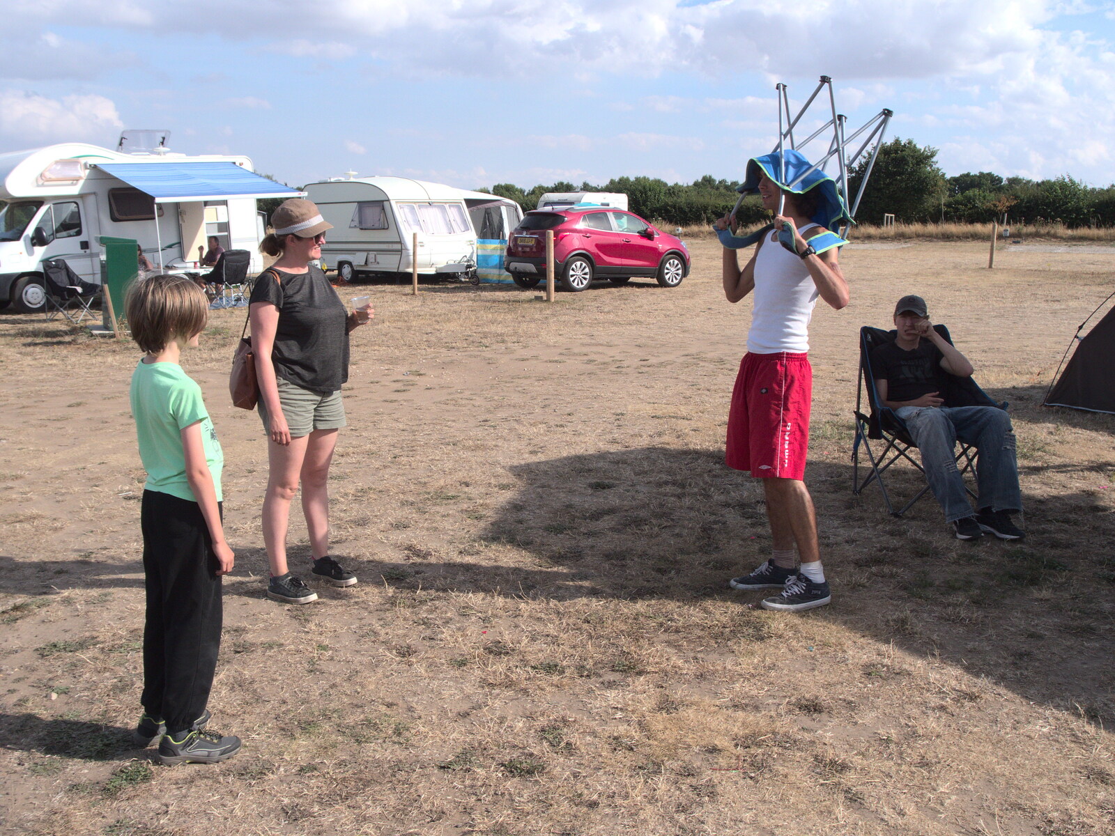 Nathan's got a camping chair on his head from A Trip to Old Buckenham Airfield, Norfolk - 6th August 2022