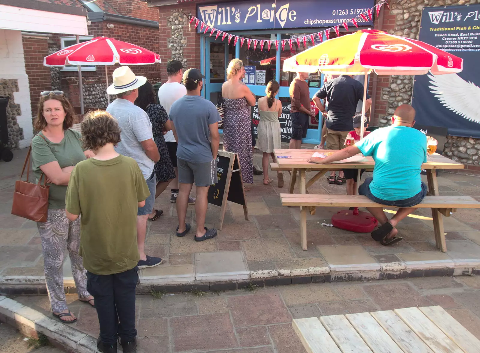 Isobel and Fred queue up at Will's Plaice, from Camping at Forest Park, Cromer, Norfolk - 12th August 2022