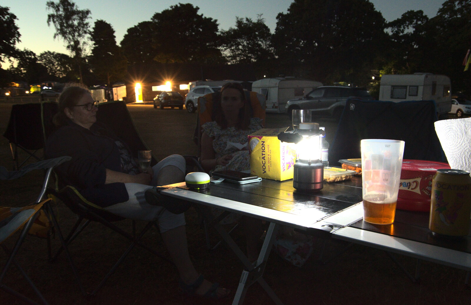 Drinks by the light of a camping lantern from Camping at Forest Park, Cromer, Norfolk - 12th August 2022