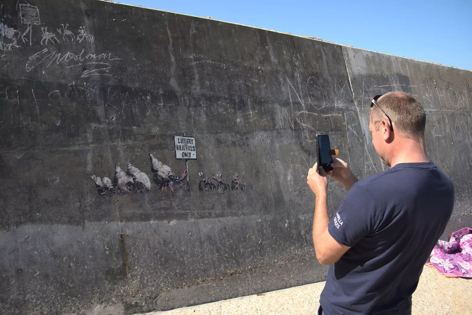 Andrew takes a photo of the Banksy, from Camping at Forest Park, Cromer, Norfolk - 12th August 2022