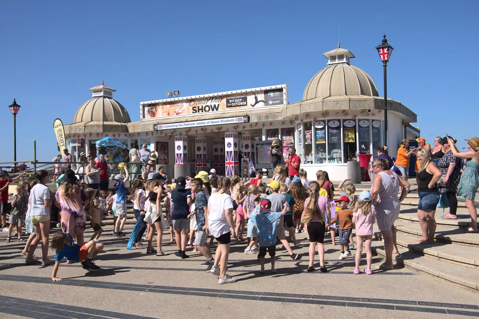 There's a gathering outside Cromer Pier, from Camping at Forest Park, Cromer, Norfolk - 12th August 2022