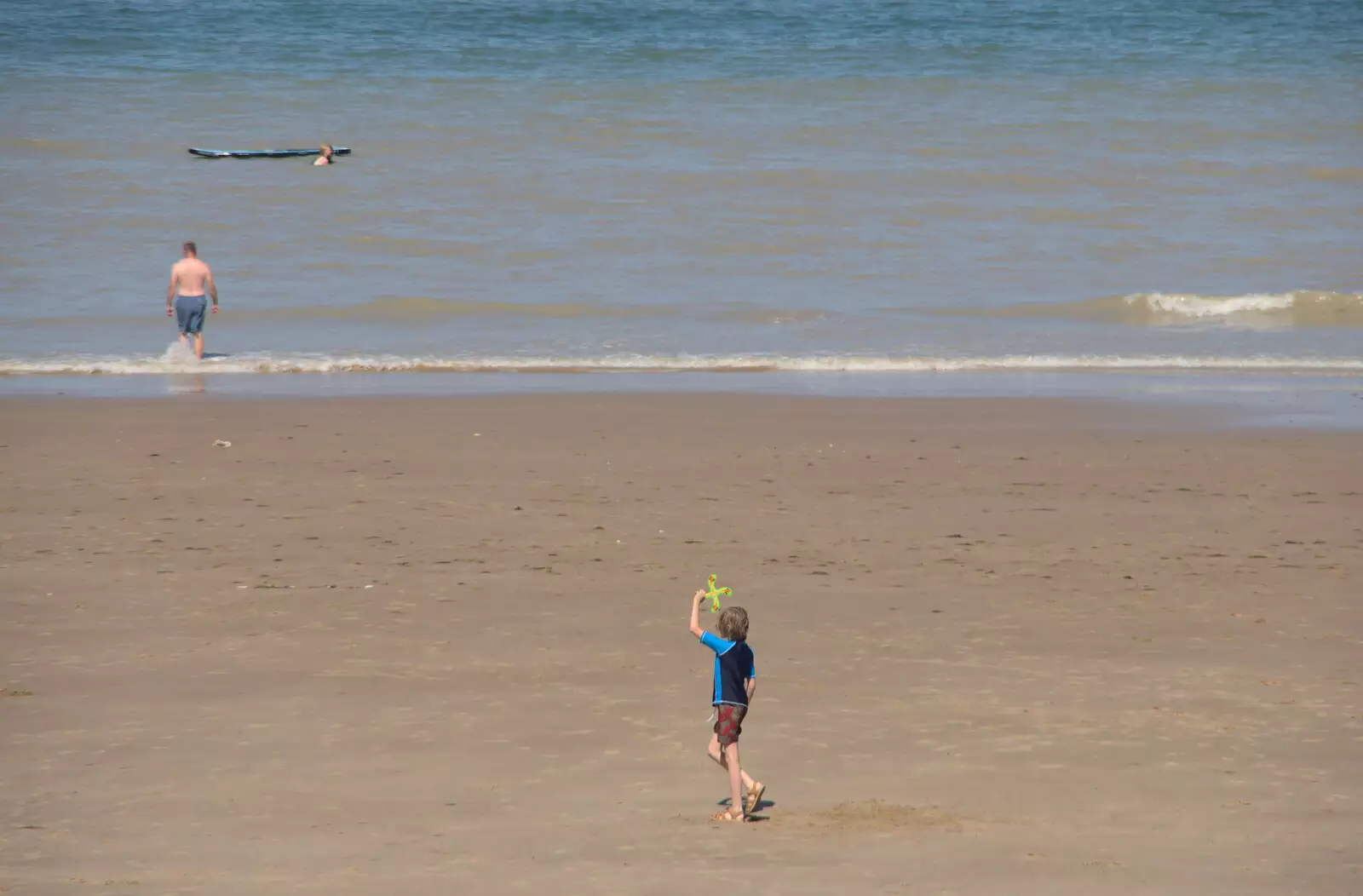 Harry flings his boomerang around on the beach, from Camping at Forest Park, Cromer, Norfolk - 12th August 2022