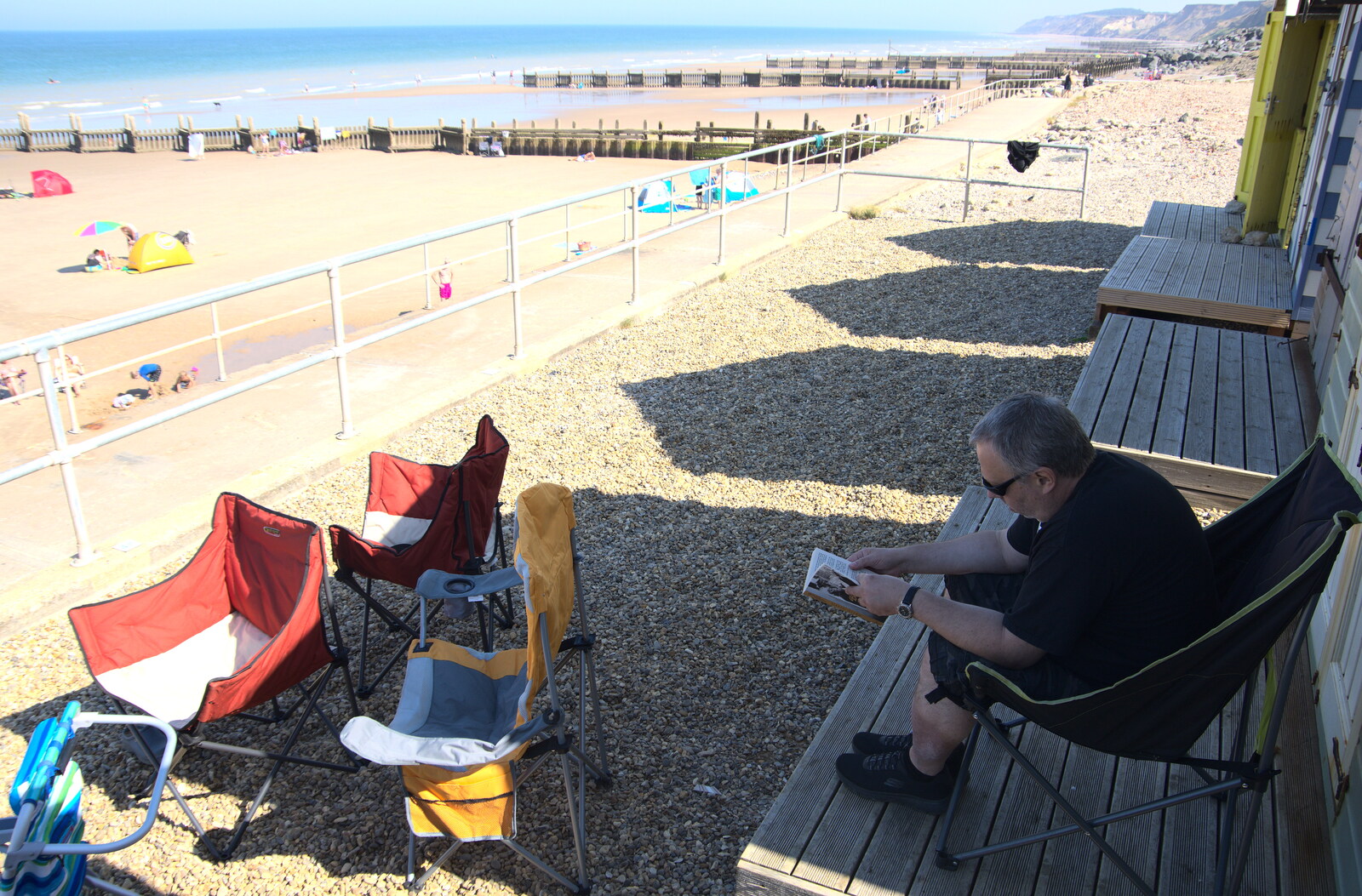 Chris reads a book from Camping at Forest Park, Cromer, Norfolk - 12th August 2022
