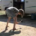 Harry 'helps' by bashing up an empty can, Camping at Forest Park, Cromer, Norfolk - 12th August 2022