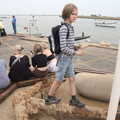 A Trip to Orford Ness, Orford, Suffolk - 16th August 2022, Harry stands on a rust anchor