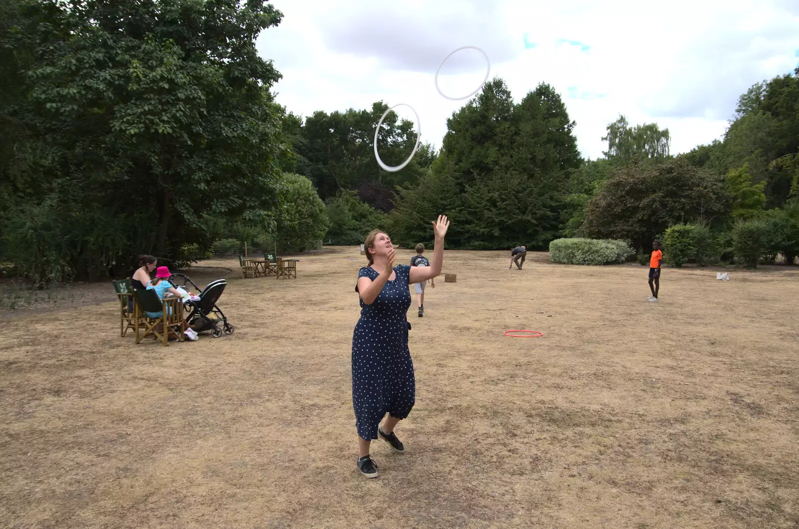 Isobel tries juggling with rings, from Anglesey Abbey and a #StandWithUkraine Demo, Cambridge - 24th August 2022