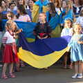 Anglesey Abbey and a #StandWithUkraine Demo, Cambridge - 24th August 2022, Girls in national dress hold a Ukrainian flag