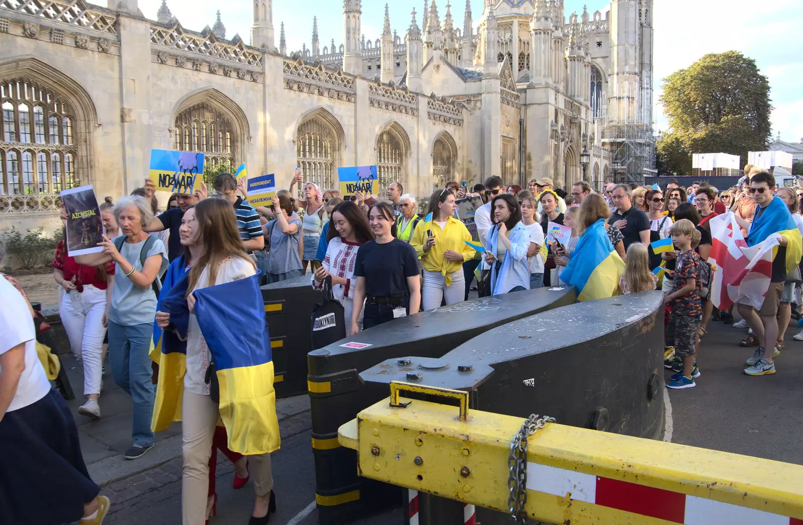 The march funnels through the anti-personnel barriers, from Anglesey Abbey and a #StandWithUkraine Demo, Cambridge - 24th August 2022