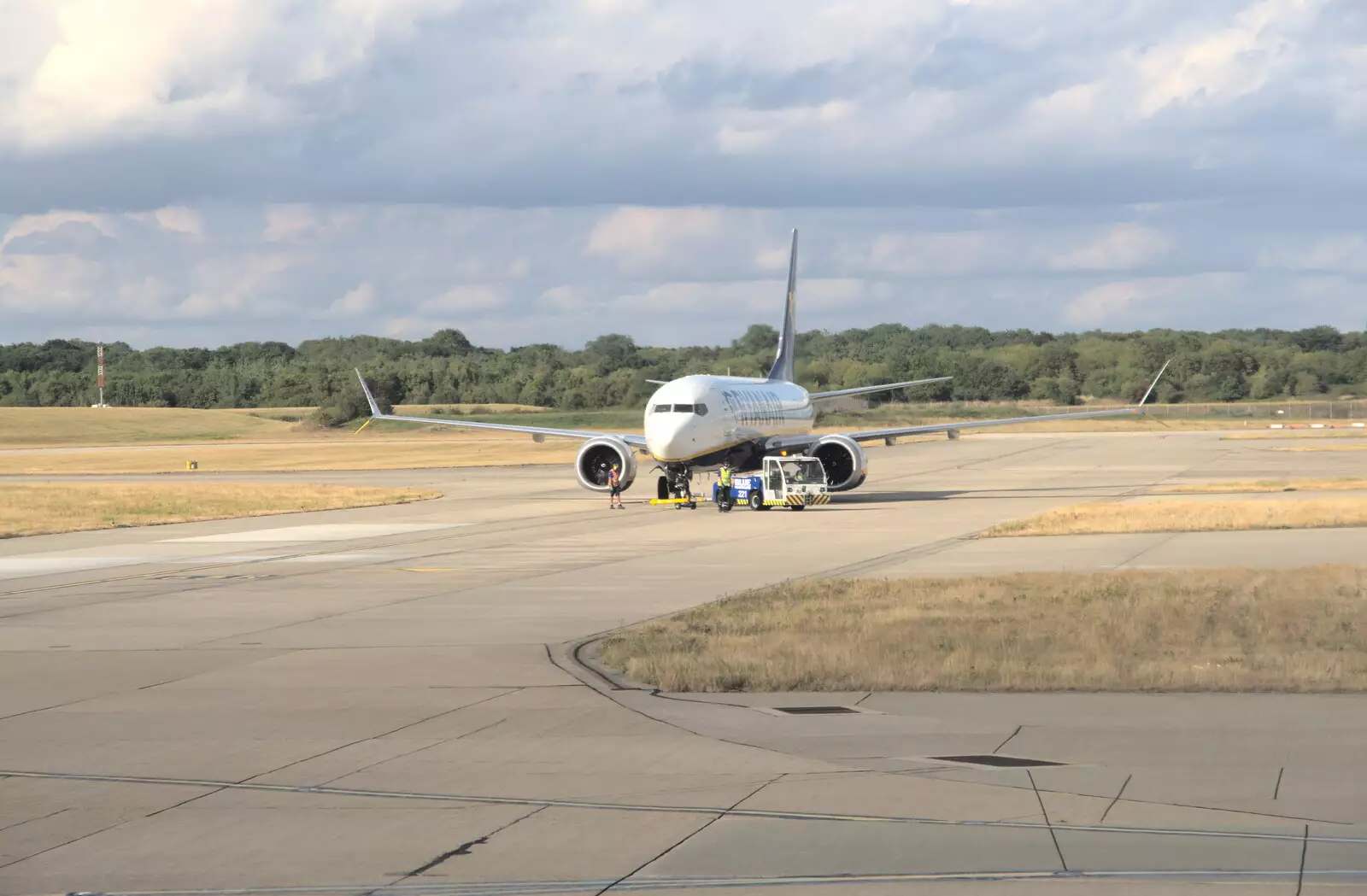 A broken-down 737 Max is towed off the taxiway, from The Flags of Arezzo, Tuscany, Italy - 28th August 2022