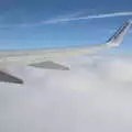 The plane breaks through the layer of clouds, The Flags of Arezzo, Tuscany, Italy - 28th August 2022