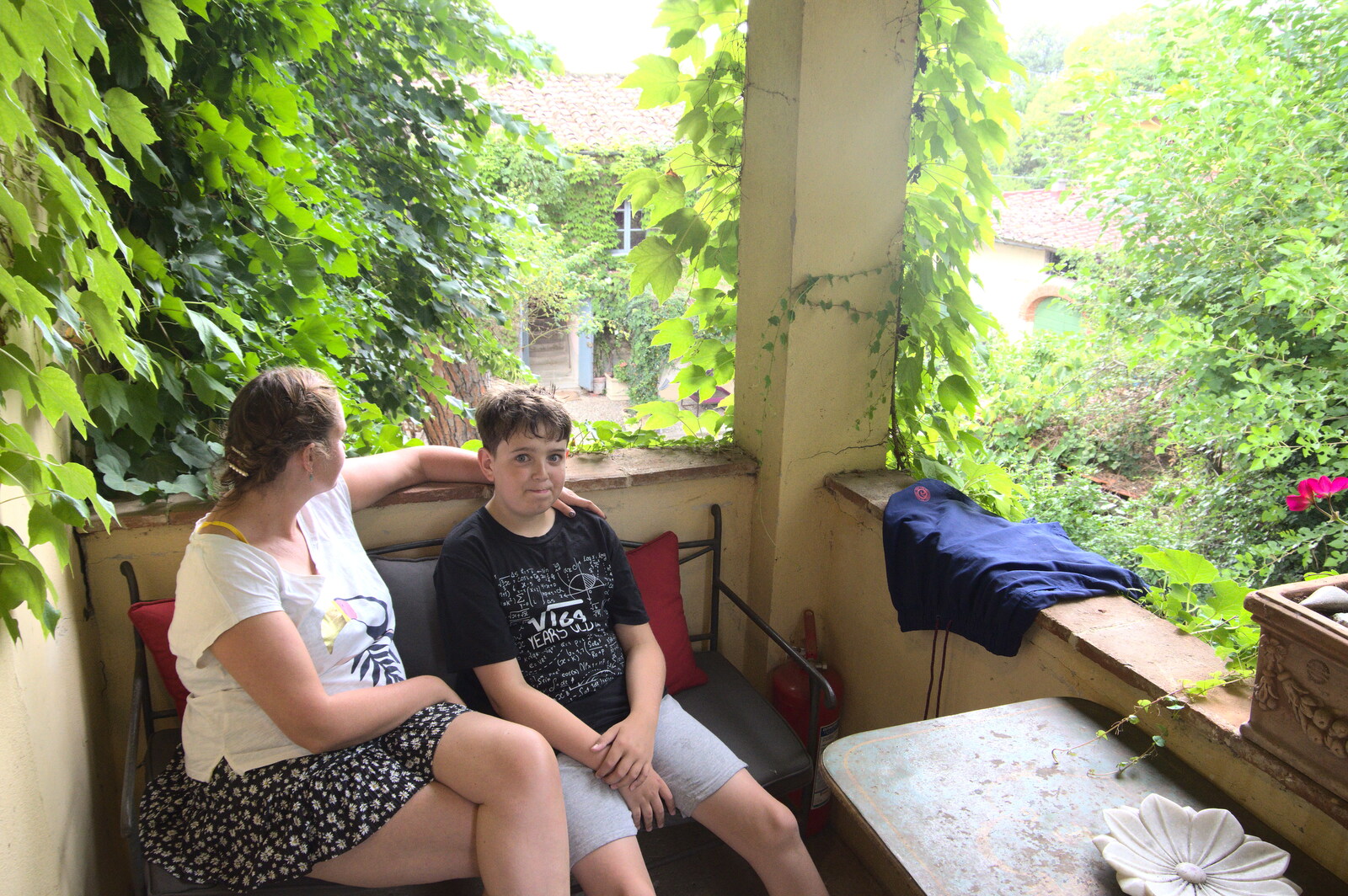 The Flags of Arezzo, Tuscany, Italy - 28th August 2022: Isobel and Fred on the balcony