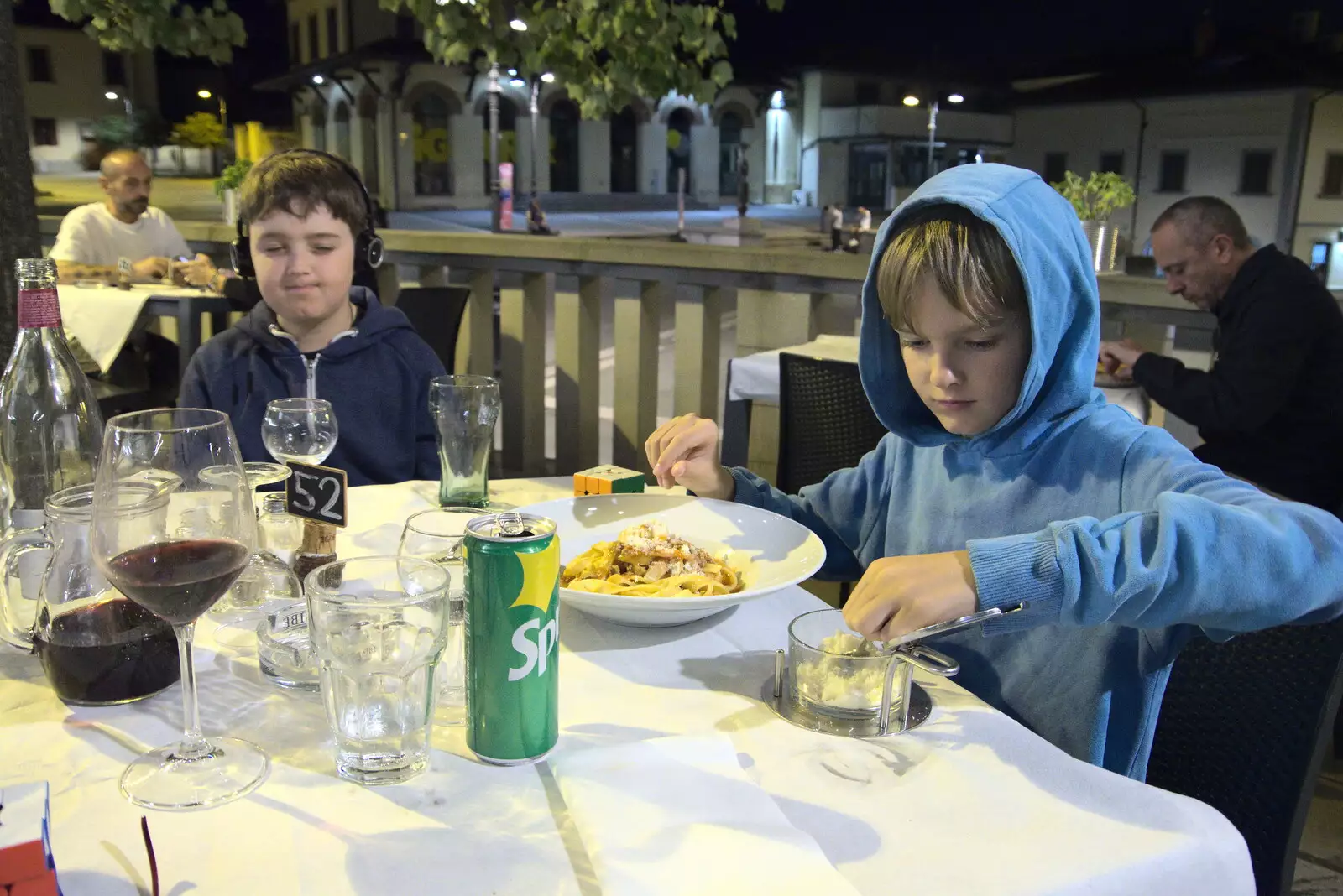 Harry cheeses up his pasta, from The Flags of Arezzo, Tuscany, Italy - 28th August 2022