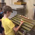 Harry lights a votive candle, The Flags of Arezzo, Tuscany, Italy - 28th August 2022