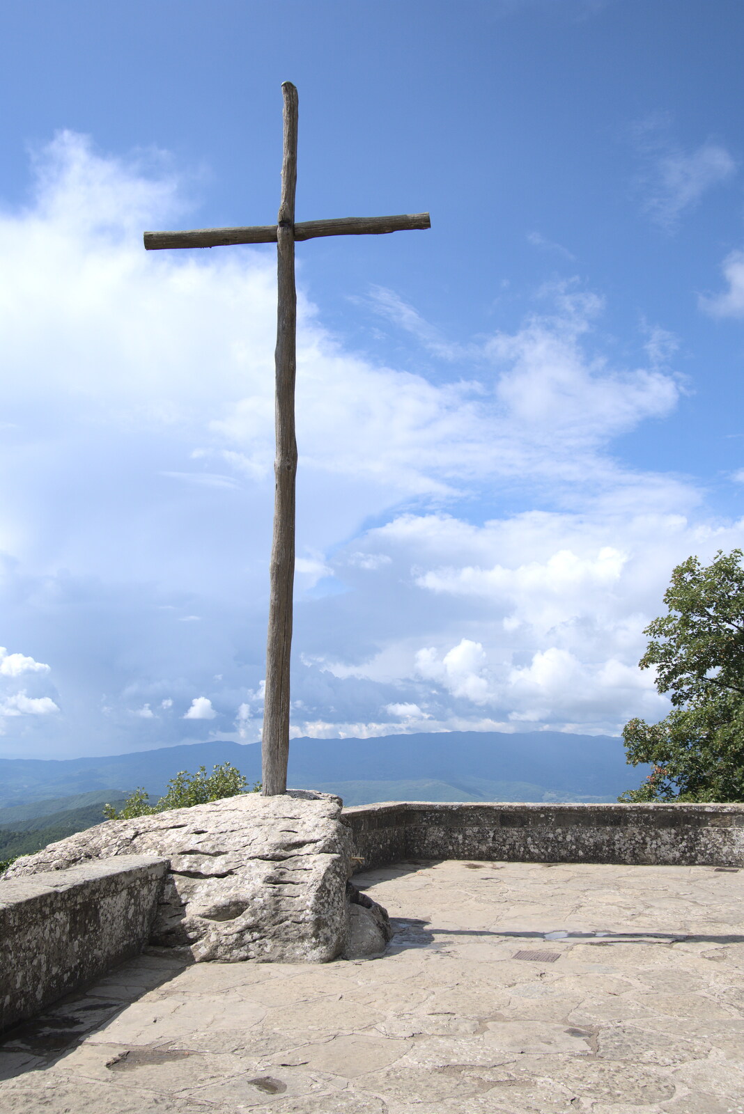 Castiglio Del Lago and Santuario della Verna, Umbria and Tuscany, Italy - 1st September 2022: The wooden cross on the top of the mountain