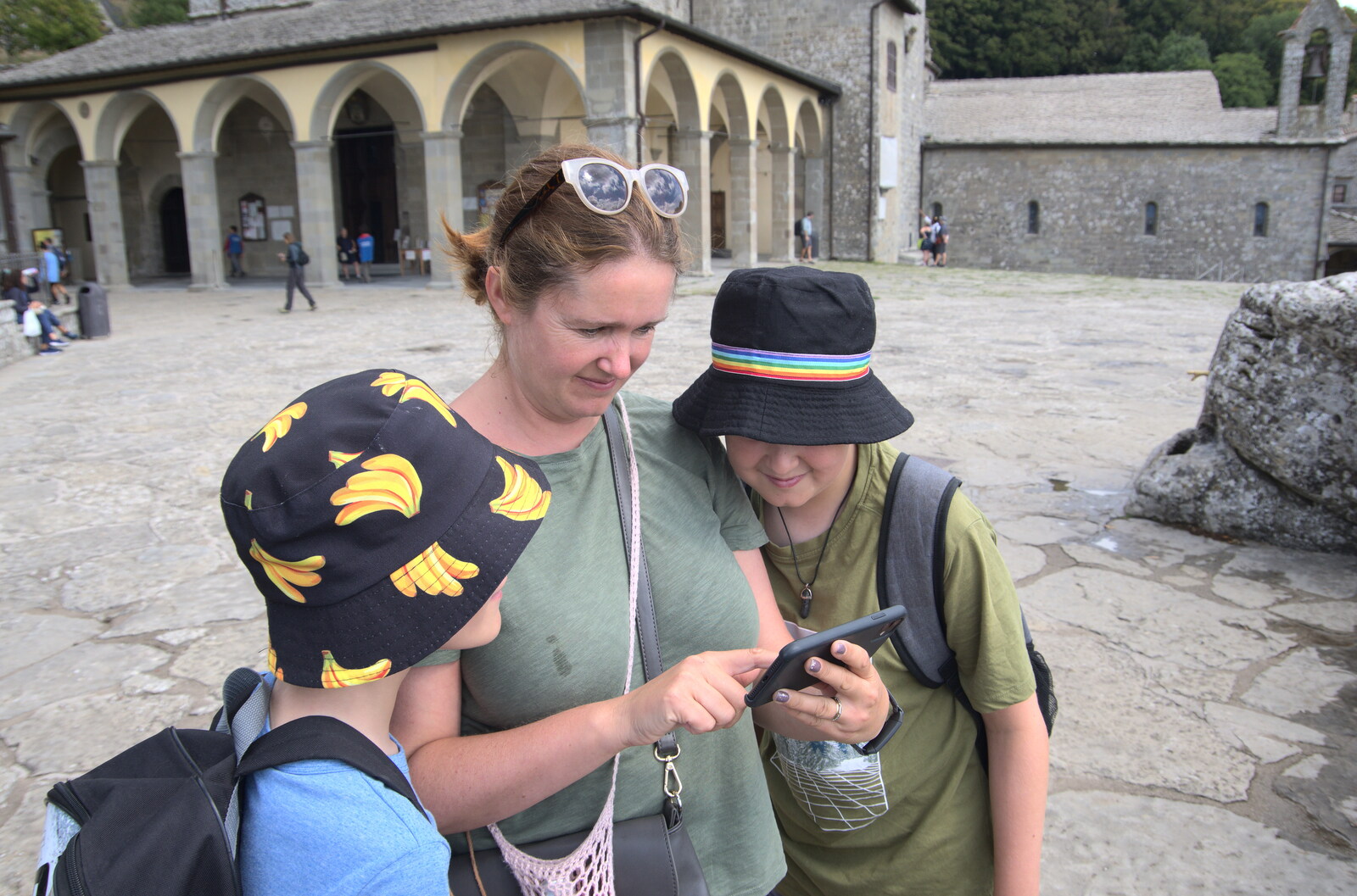Castiglio Del Lago and Santuario della Verna, Umbria and Tuscany, Italy - 1st September 2022: Harry, Isobel and Fred look at a phone photo