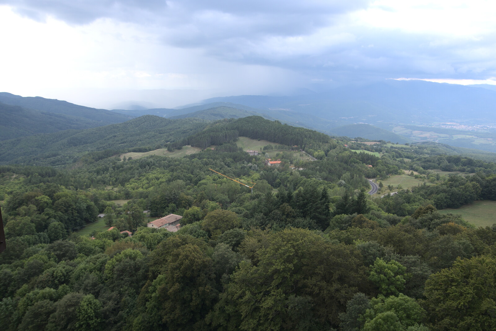 Castiglio Del Lago and Santuario della Verna, Umbria and Tuscany, Italy - 1st September 2022: Rain moves over the valley
