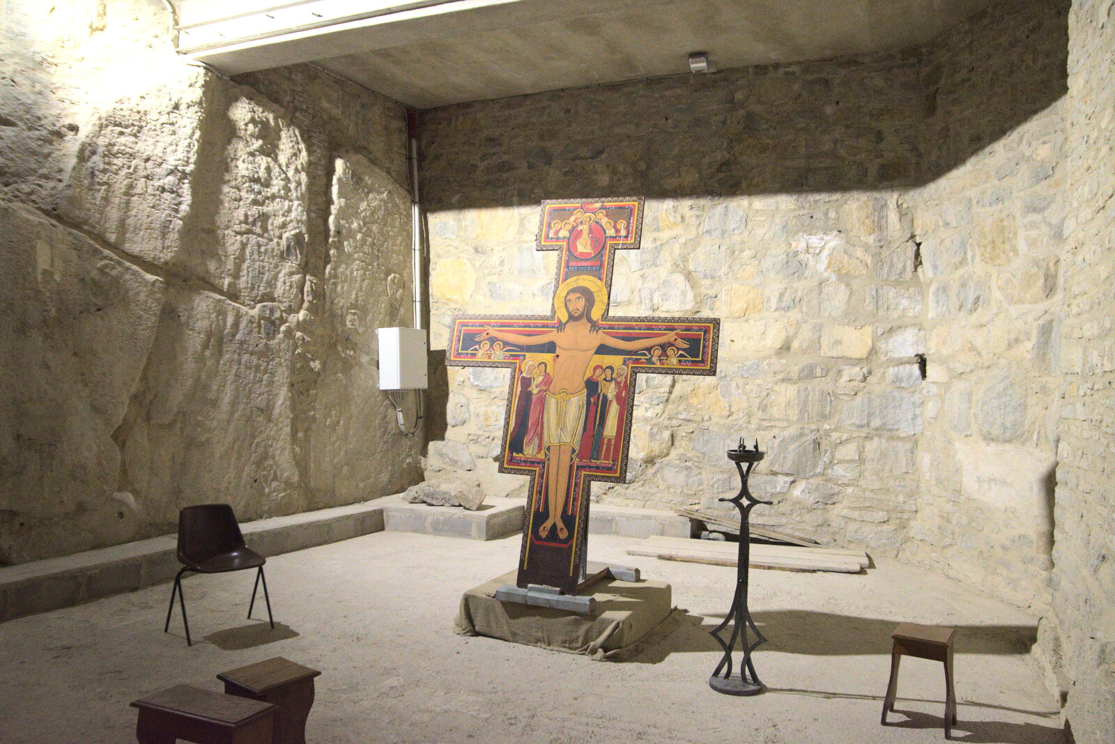Castiglio Del Lago and Santuario della Verna, Umbria and Tuscany, Italy - 1st September 2022: A cross in a basement cave