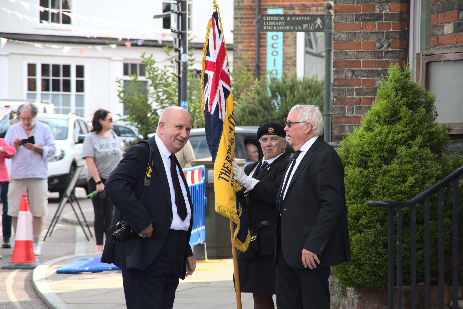 Italian Cars and a Royal Proclamation, Eye, Suffolk - 11th September 2022: The Royal British Legion flag-bearer is in place