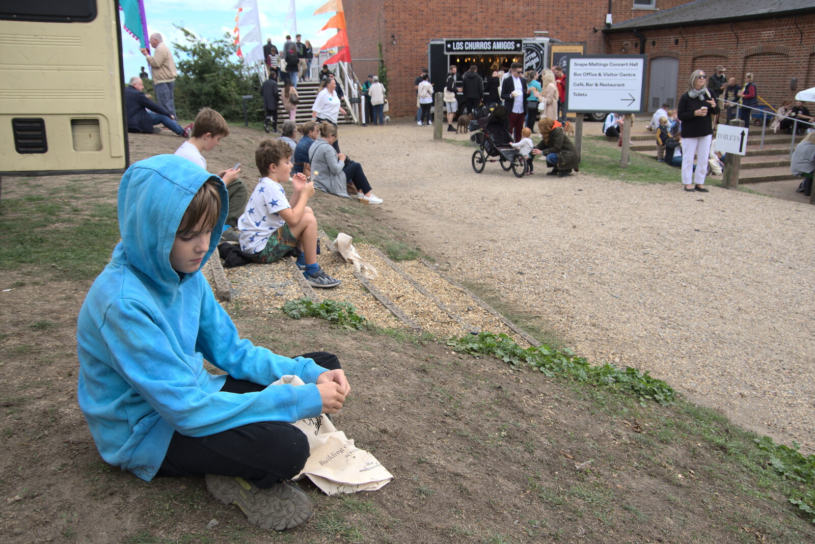 Harry has a few churros from The Aldeburgh Food Festival, Snape Maltings, Suffolk - 25th September 2022