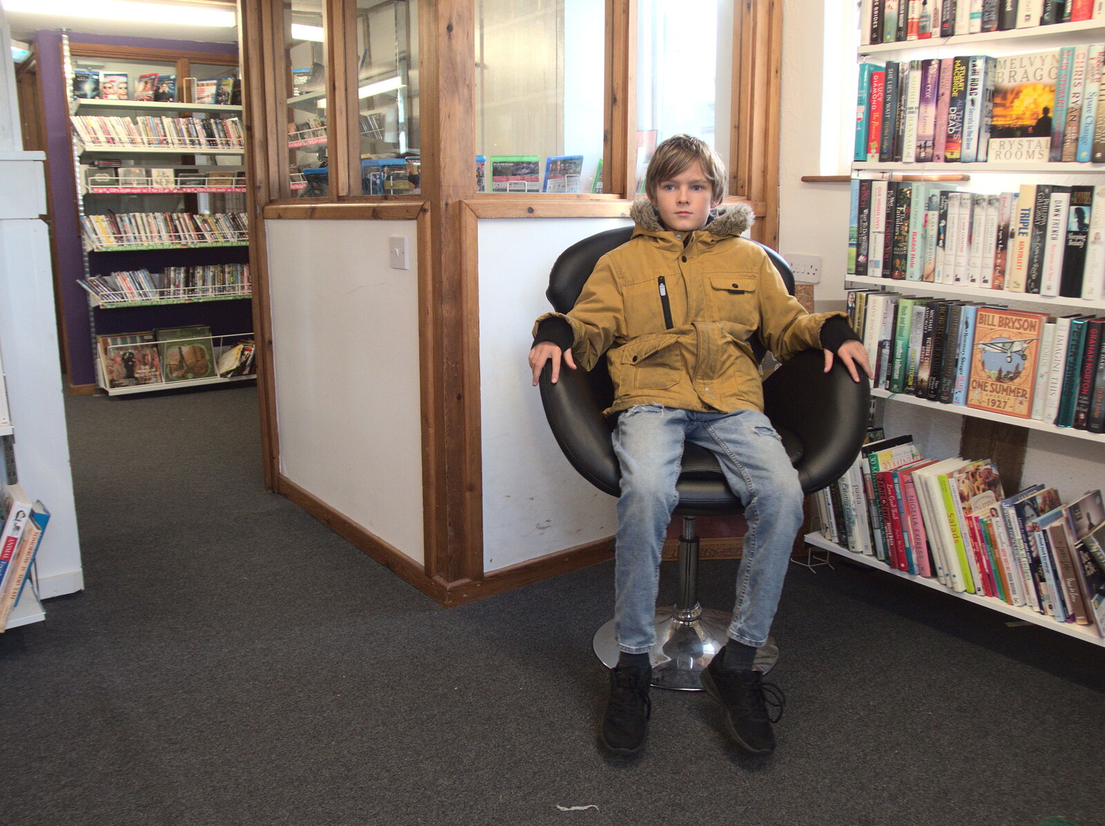 Pizza and Pasta in Bury St. Edmunds, Suffolk - 30th October 2022: Harry takes a seat in the charity shop library