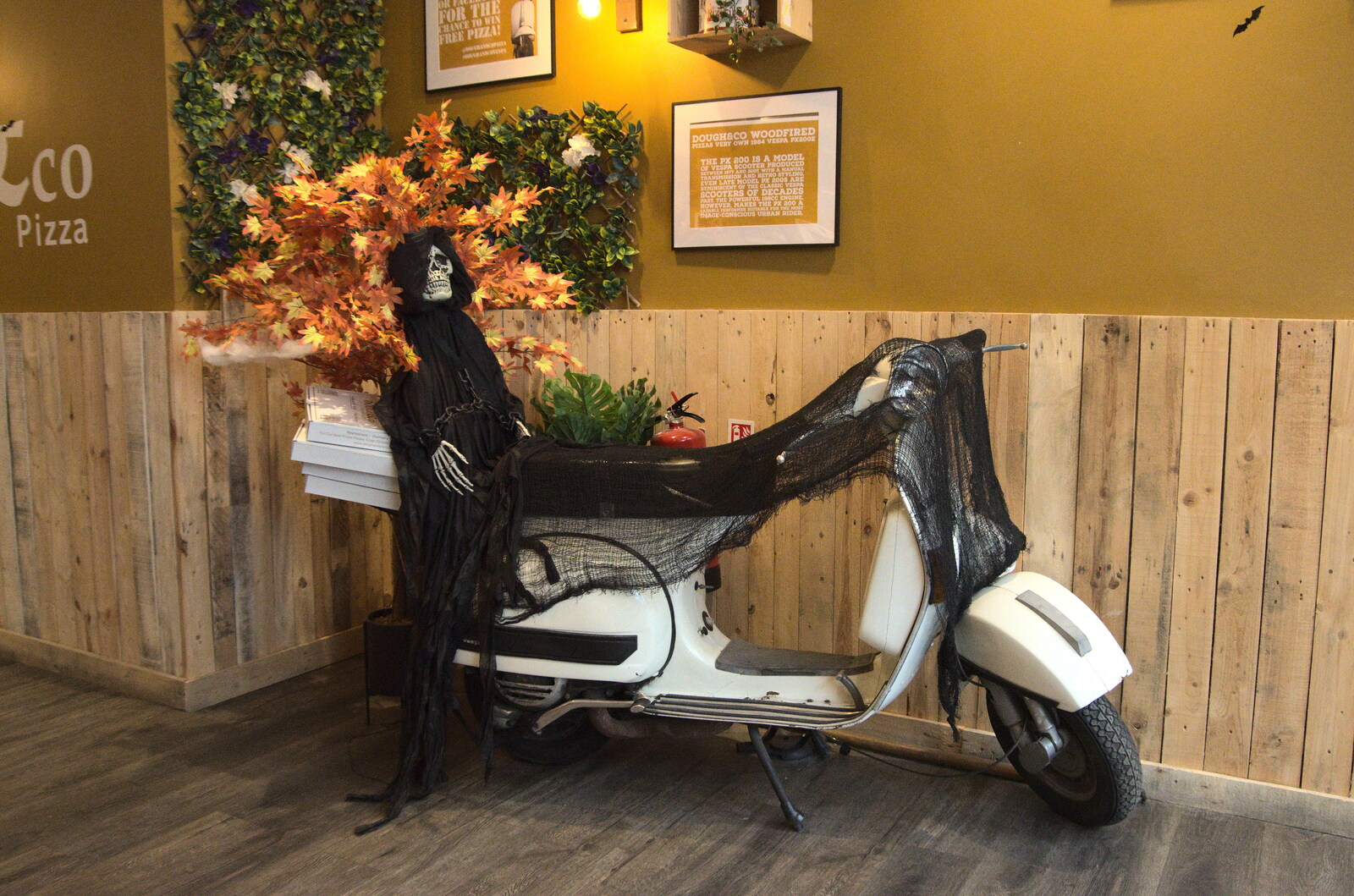 Pizza and Pasta in Bury St. Edmunds, Suffolk - 30th October 2022: The pizza place has a skeleton on a Vespa