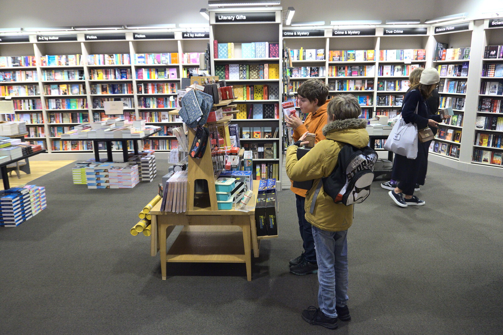 Pizza and Pasta in Bury St. Edmunds, Suffolk - 30th October 2022: The boys look at new books in Waterstones