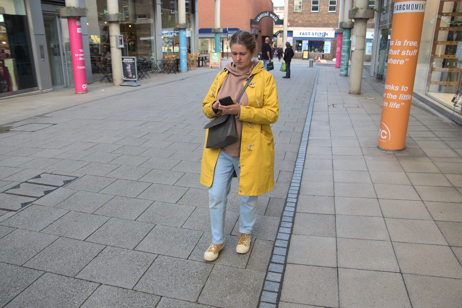 Pizza and Pasta in Bury St. Edmunds, Suffolk - 30th October 2022: Isobel checks her phone