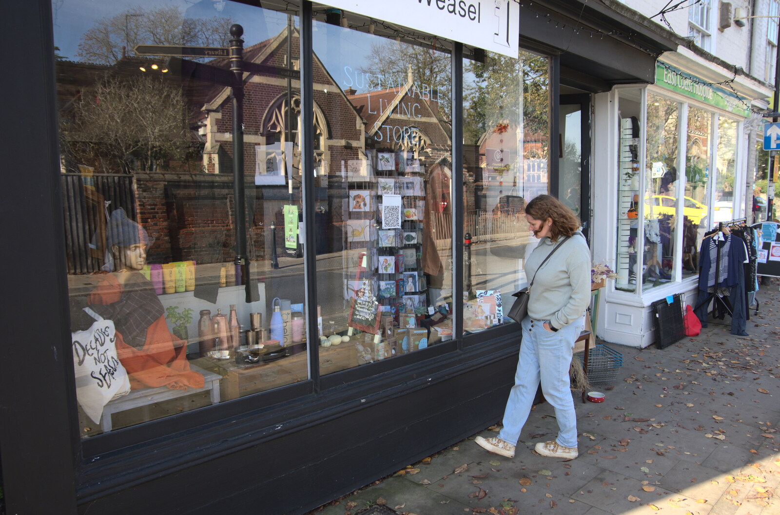 A Postcard from Bungay, Suffolk - 2nd November 2022: Isobel looks in a shop window