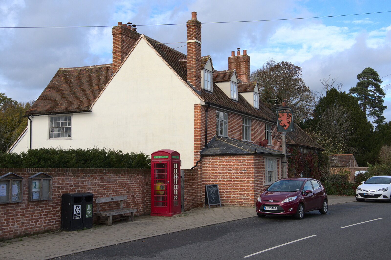 A Postcard from Flatford and Dedham, Suffolk and Essex, 9th November 2022: A K6 phonebox outside the Red Lion
