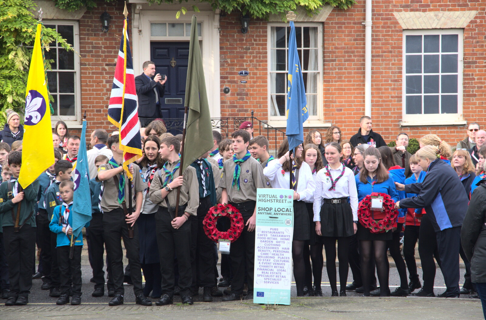 The Scouts' Remembrance Day Parade, Eye, Suffolk - 13th November 2022: Various Scouts hold on to flags