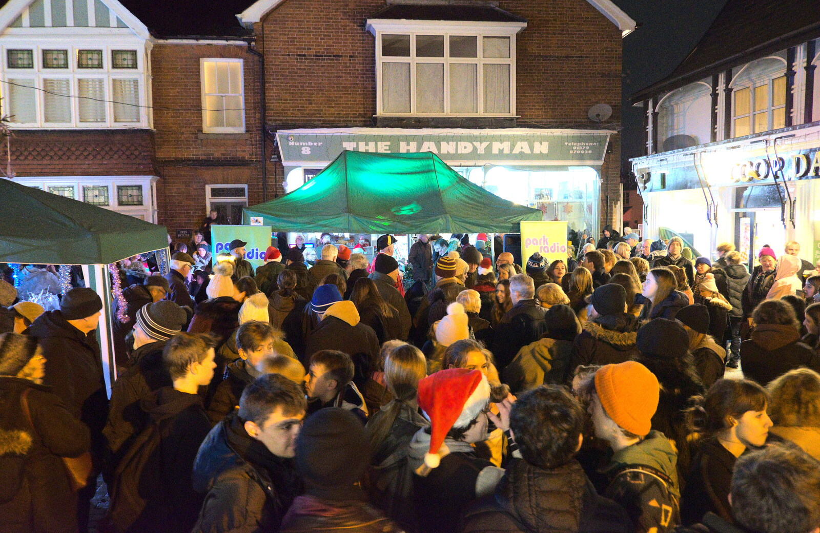Crowds throng outside the Handyman and Co-op from Eye Lights and the GSB at Botesdale, Suffolk - 2nd December 2022