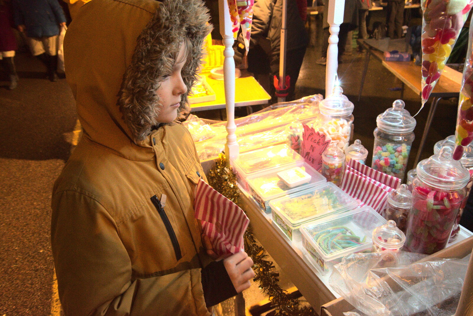 Harry looks at a load of sweets on the Scout stand from Eye Lights and the GSB at Botesdale, Suffolk - 2nd December 2022