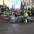 A digger hauls itself up after shedding a track, Christmas Shopping in Norwich, Norfolk - 21st December 2022