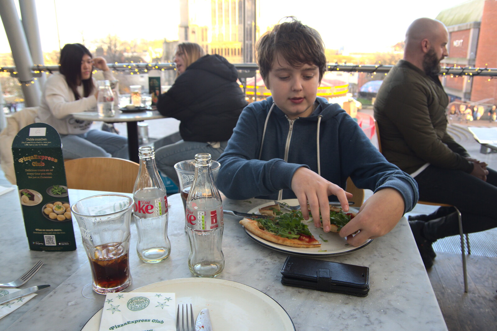 Fred wrangles the rocket on his pizza from Christmas Shopping in Norwich, Norfolk - 21st December 2022