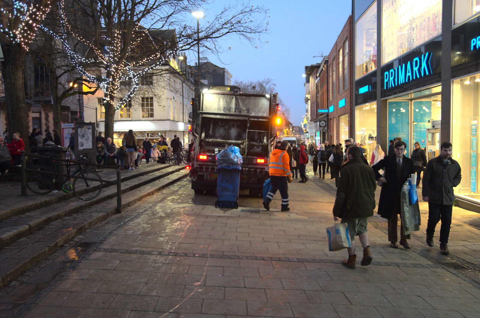 The bins are emptied on Haymarket from Christmas Shopping in Norwich, Norfolk - 21st December 2022
