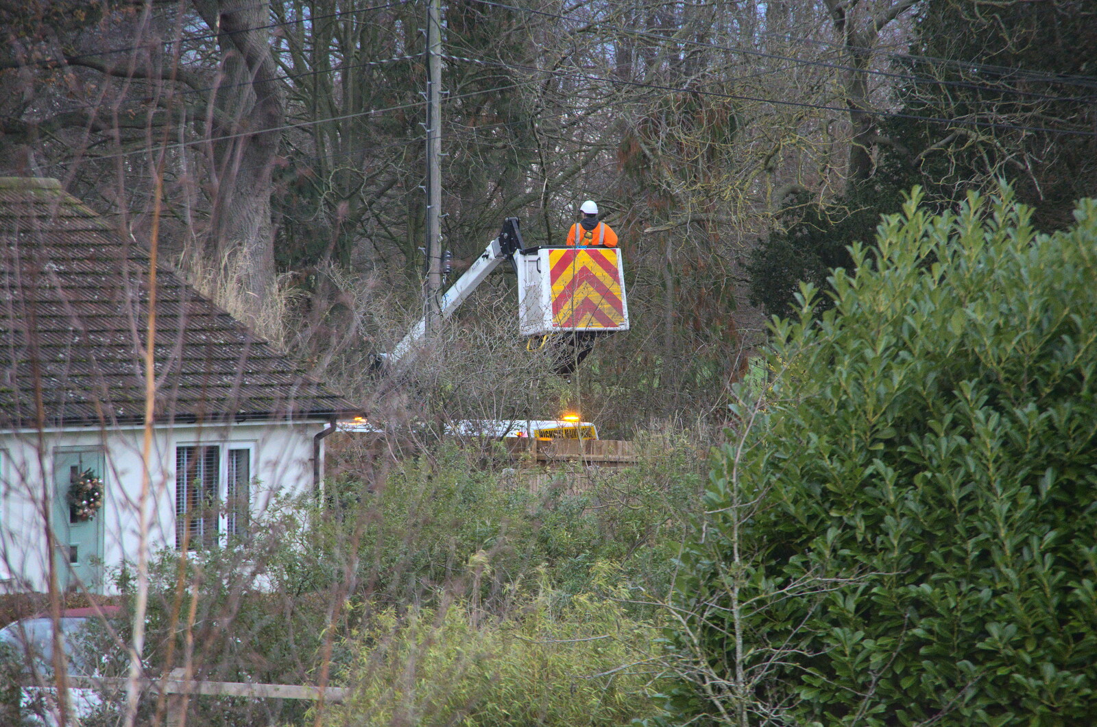 Openreach is up a pole putting our new fibre in from Christmas Shopping in Norwich, Norfolk - 21st December 2022