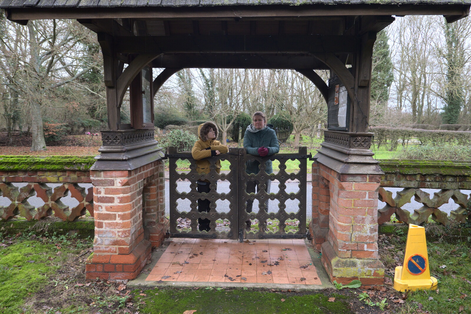 Winter Walks around Brome and Hoxne, Suffolk - 2nd January 2023: Harry and Isobel hang around on the lych gate