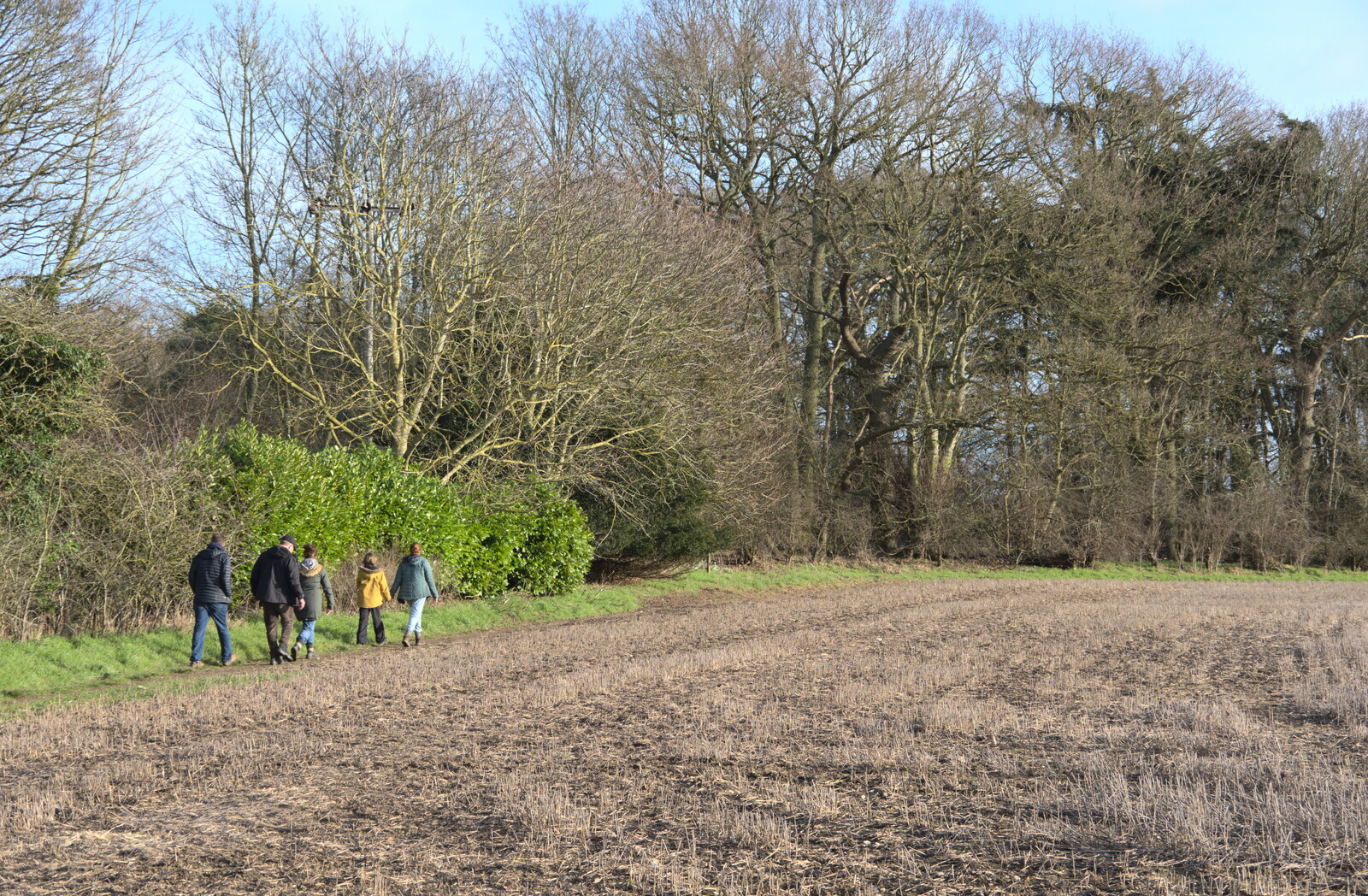 The walkers roam the edge of a field in Oakley from Another Walk to The Swan, Hoxne, Suffolk - 5th February 2023