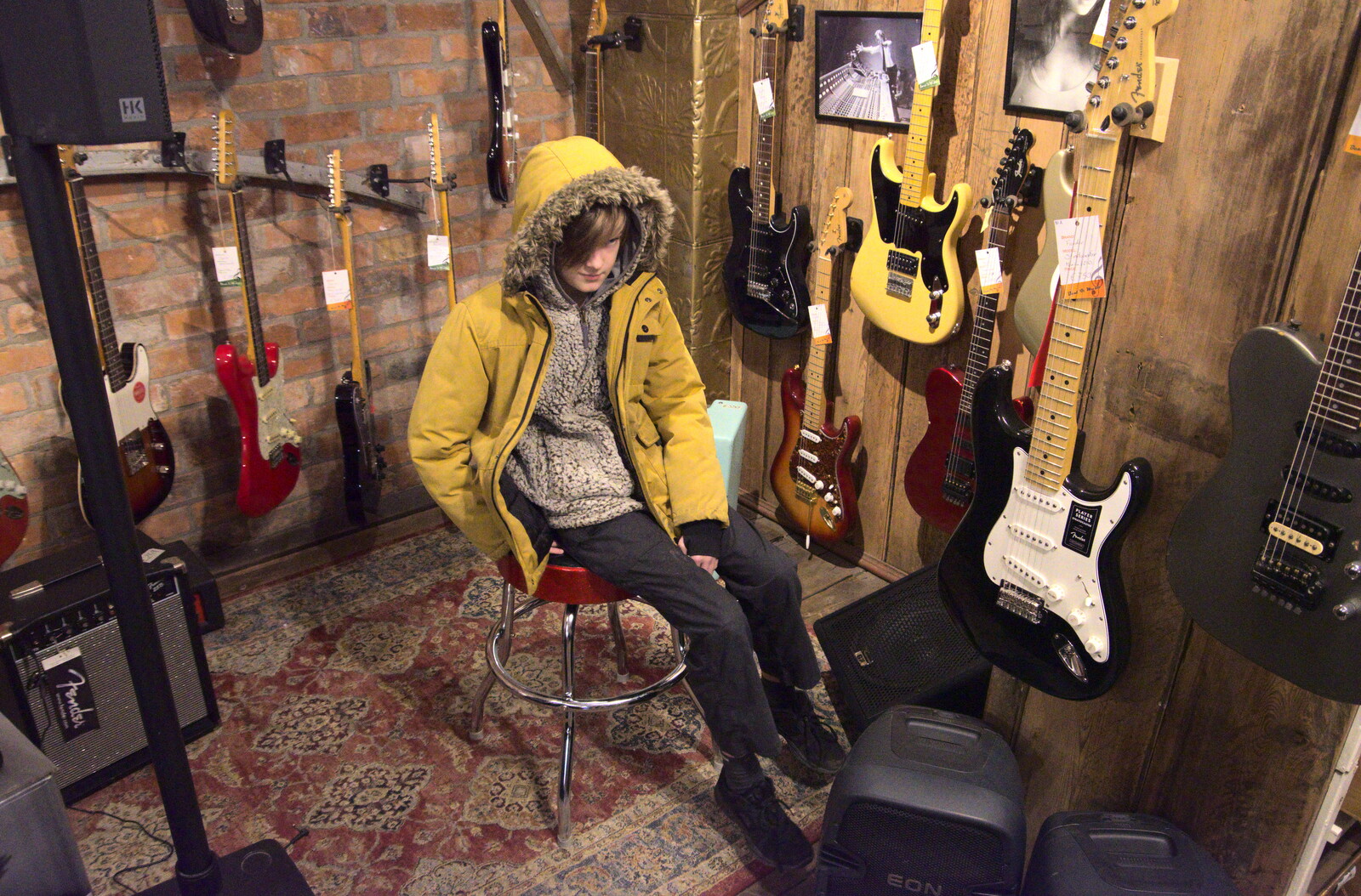 Blackrock North and Newgrange, County Louth, Ireland - 16th February 2023: Harry tries the dum stool in the music shop