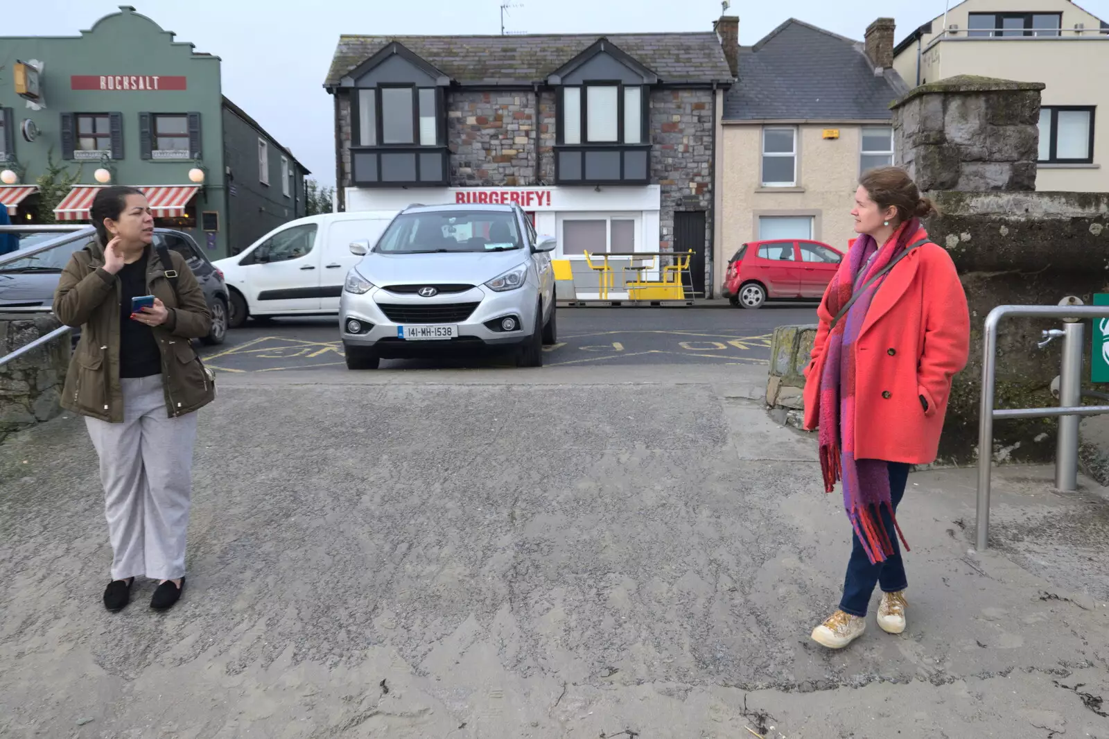 Haryanna and Isobel chat on the beach, from Blackrock North and Newgrange, County Louth, Ireland - 16th February 2023